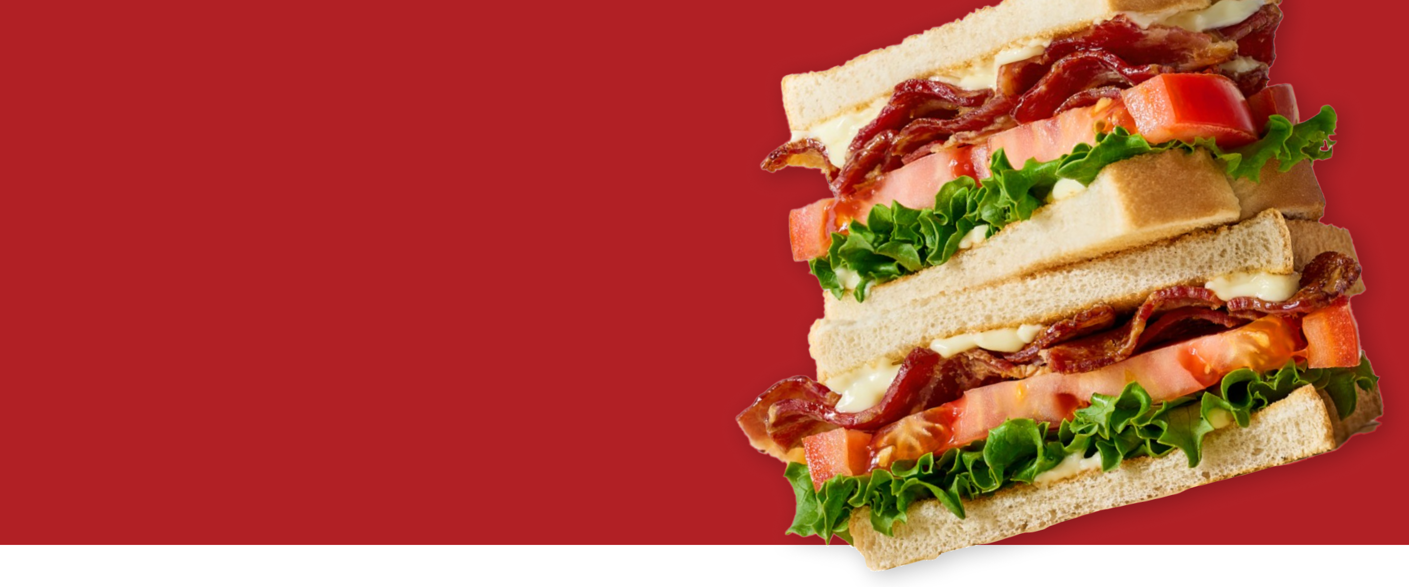 Stack of sandwiches with visible layers on a red background